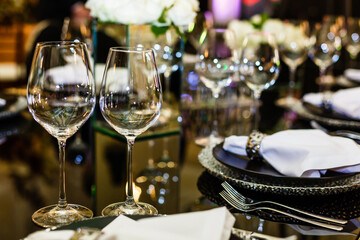 Wine glasses on dining table. Gala banquet table setting with glasses for wine champagne