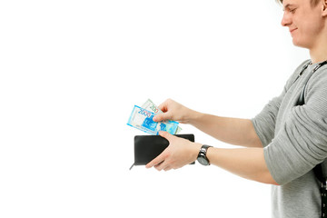 a man takes money Russian rubles from his wallet on an isolated white background