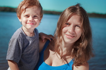 mother and son together at the beach portrait retro and vintage