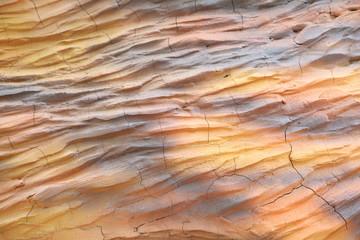 Cement background with a texture of a orange wall 