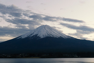 Fototapeta na wymiar blur Fuji mountain with snow cap and blue sky background