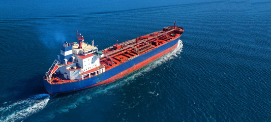 Aerial drone ultra wide photo of industrial fuel and gas tanker ship cruising the Mediterranean...