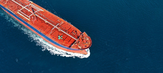 Aerial drone ultra wide photo of industrial fuel and gas tanker ship cruising the Mediterranean...