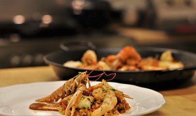 Vegetables and Fish used to cook Paella in the typical Spanish Way. This Spanish speciality can be made with seafood or meat