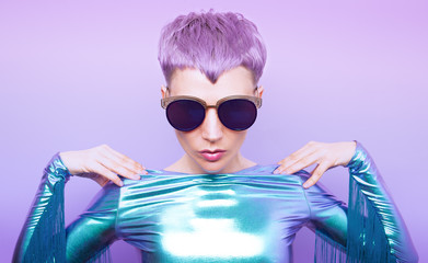 Futuristic model with violet hair. Trendy haircut