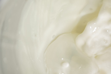 Fototapeta na wymiar Flowing white milk, soft focus