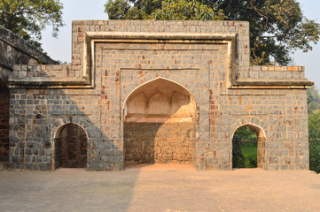 A architecture at humayun tomb memorial from the side of the lawn at winter foggy morning.