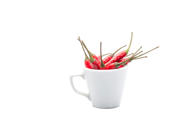 A bunch of red chilies in cup with isolated background