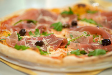 Pizza with ham and olives