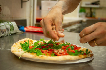 preparing pizza
