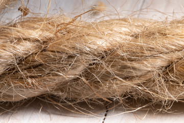 linen rope texture closeup. old frayed boat rope as background