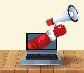 Laptop computer and hand holding a megaphone over wooden and white background, colorful design