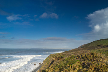 Fototapeta na wymiar Coast path leading into Westward Ho on the North Devon coast of England looking across Bideford Bay 