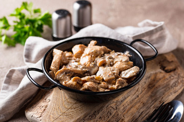 Stewed chicken fillet with mushrooms