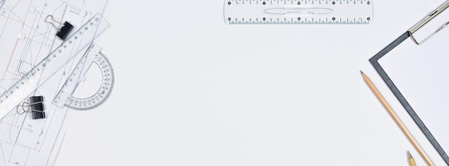 Architectural plans, pencil and ruler on the table. Working surface. Place for your text. View from above.