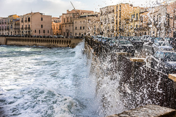  sea ​​waves crashing against the city wall