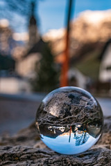 Crystal ball alpine landscape shot at the famous church at Ramsau, Berchtesgaden, Bavaria, Germany