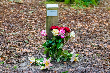 Roses and lilies left in memoriam
