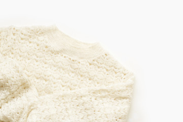  Warm knitted sweater on white background. Minimalistic flatlay
