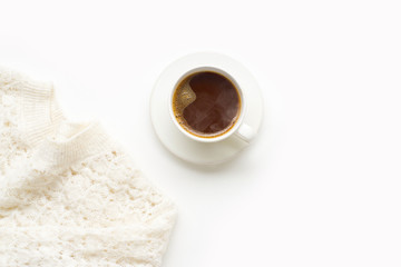 Flatlay with knitted sweater and a cup of coffee