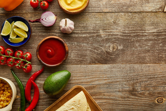 Top View Of Raw Ingredients For Taco On Wooden Background With Copy Space