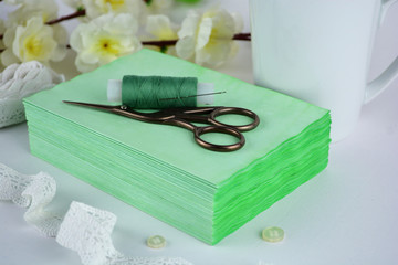 The bookbinding process and the handmade notebook. Threads, scissors and pages. Handmade coptic binding. Paper crafts, scrapbooking.