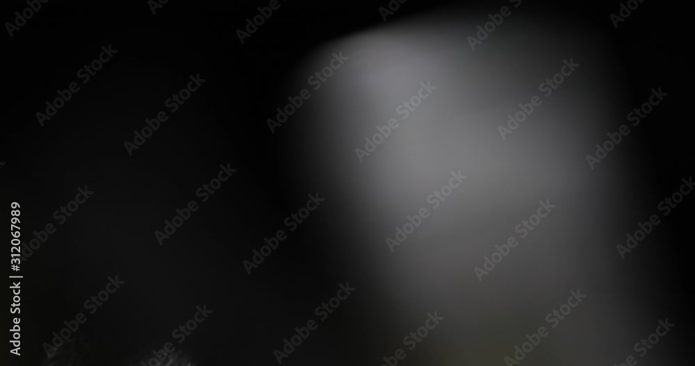 Wall mural abstract bokeh light background for overlay. real lens flare light effect. sparkle ray leak on black
