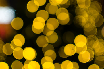 Abstract Bokeh background of defocused glittering lights. Christmas, Party, New Year, luxurious background pattern concept. banner