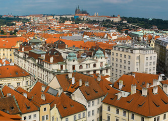 Fototapeta na wymiar view of the red roofs of Mala Strana and St. Vitus Cathedral in Prague, Czech Republic.