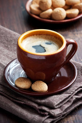 Coffee cup with vanilla cookies  on wooden  table