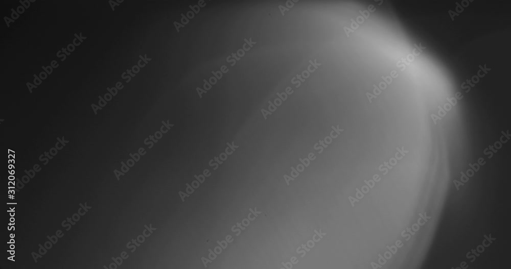 Wall mural abstract bokeh light background for overlay. real lens flare light effect. sparkle ray leak on black