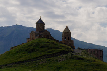  Trinity Church. Kazbek Stepantsminda. Georgia. Temple in the mountains against the backdrop of the mountains.