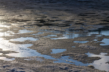 ice melting under the sun on the river during the spring thaw