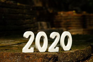 2020 white number new year with old vintage brick wall background