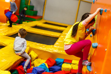 Fototapeta na wymiar Children playing on a inflatable trampoline