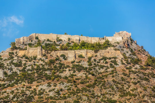 Impressive fortress ruins on a mountain top against a clear blue sky. Castle Softa in Turkey, the Mersin Province