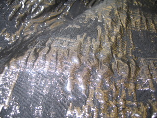shiny fabric draped with macroscheiki and bokeh