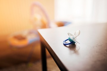 baby pacifier isolated on table