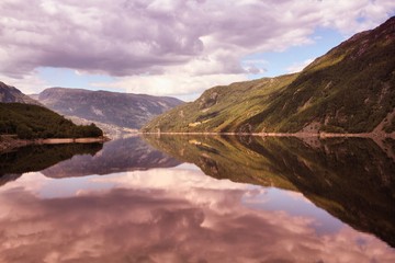 Fototapeta na wymiar Norway lake reflection. Filtered colors style.