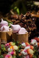 Pink merengue in the middle of a dessert table