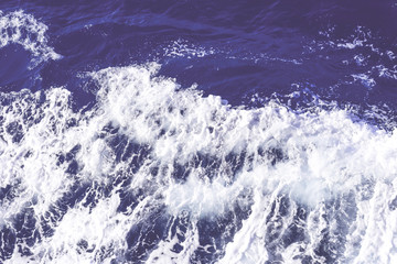 Fototapeta na wymiar Clean pure Mediterranean sea surface with a lot of tiny waves, bubbles and foam. Copy space background.