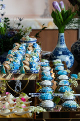 Asian food set up with fortune cookies, sushi, dessert 