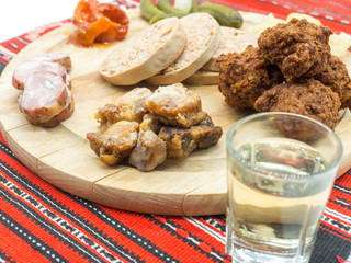 traditional christmas plateau of various pork appetizers on traditional red cloth 