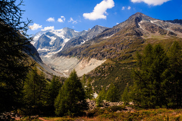 Scenic view on some high peaks of the Pennine alps near Val 'd Anniviers and glaciers running down to the valley in summer