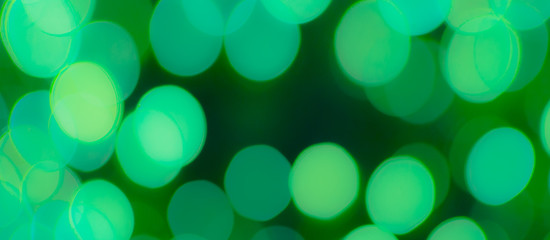 Abstract Bokeh Blue and green background of defocused glittering lights. Christmas, Party, New Year, luxurious background pattern concept. banner.