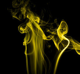 Yellow smoke on black background