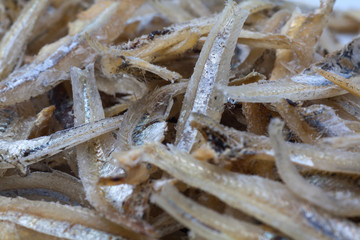 dried anchovies on a white background