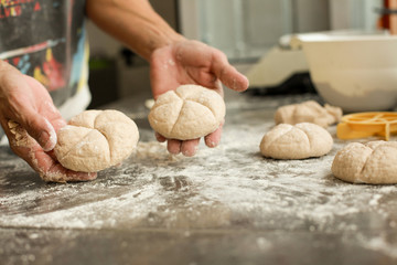 hands crumple dough, 