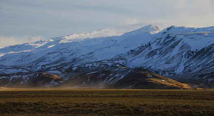 Fototapeta na wymiar Fabulous winter sunrise in the Iceland. Sunrise against the background of mountainous