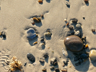 Pebbles on a sandy beach